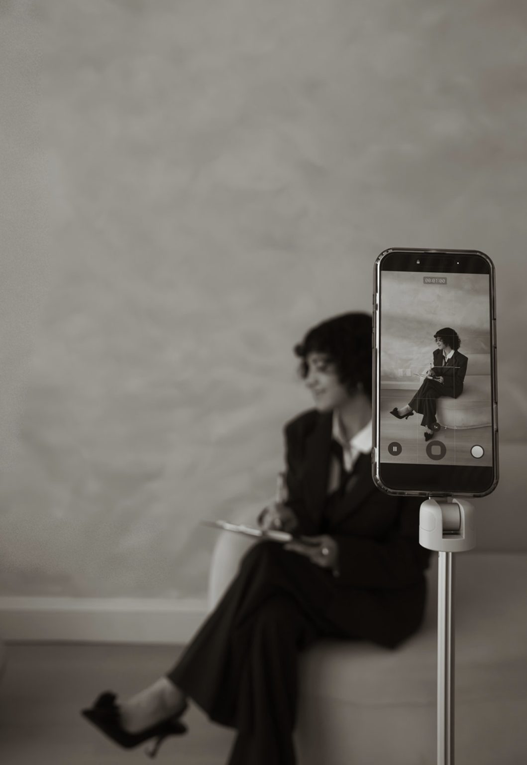Annie filming herself on a phone tripod