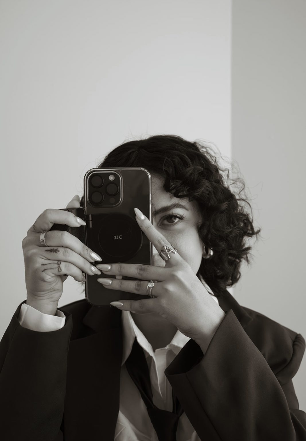 Annie holding a phone camera up to her eye